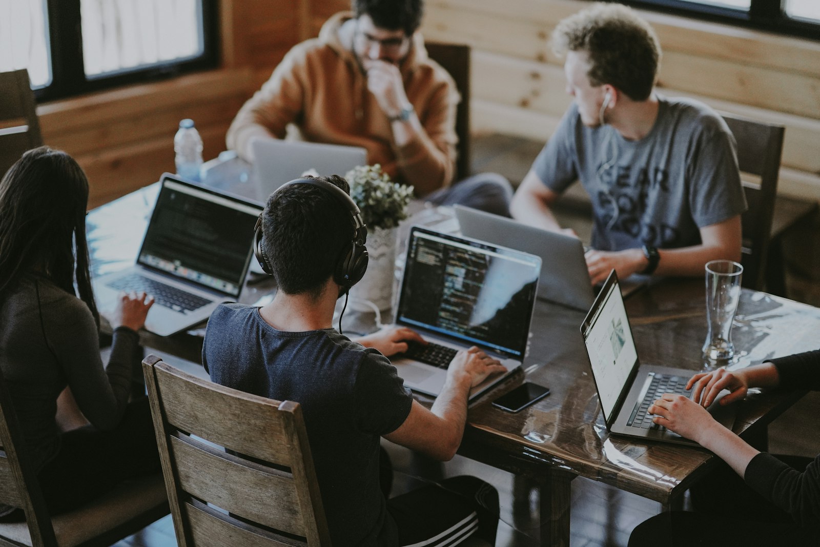 A team working together around a wooden table